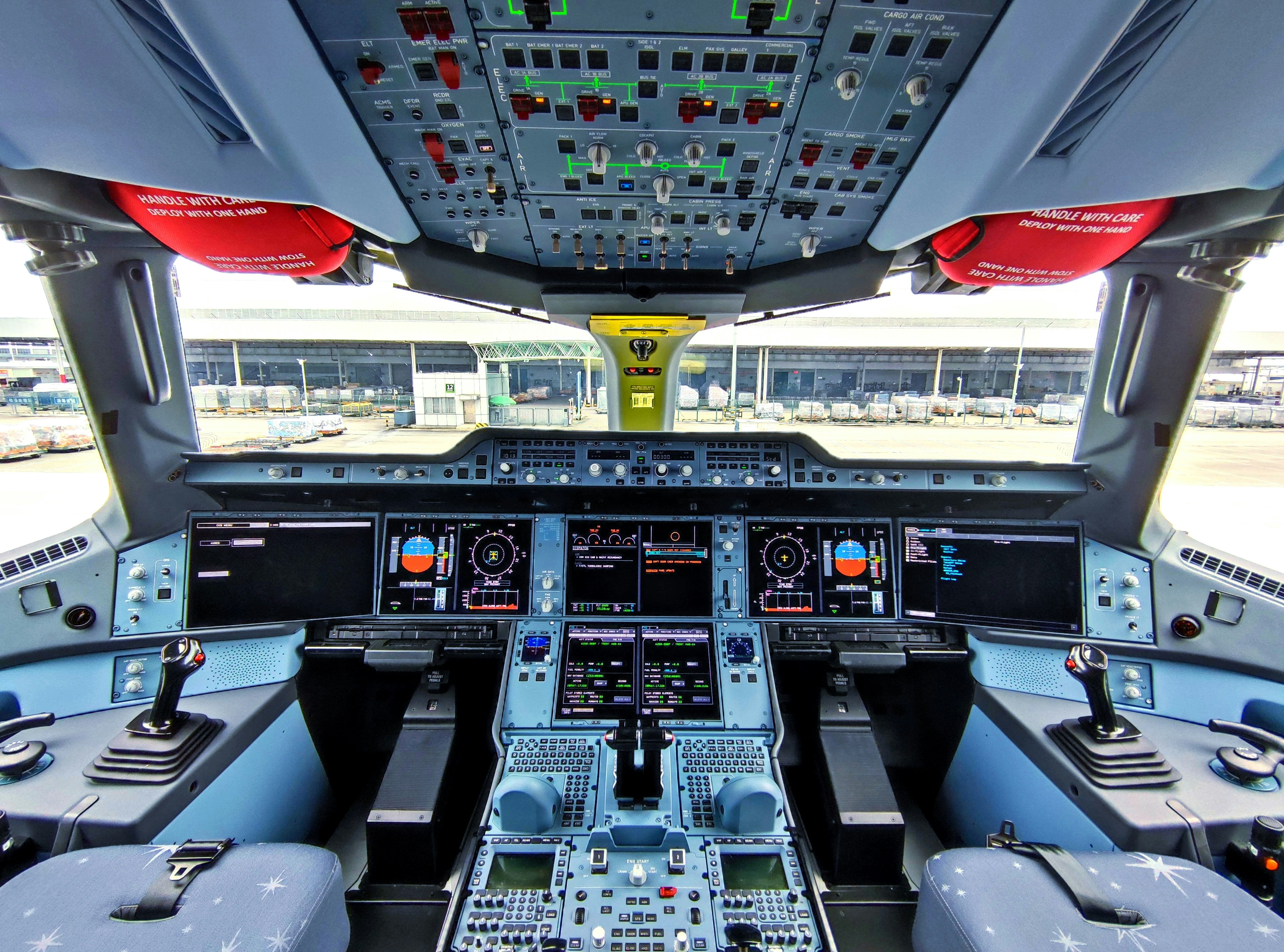 Commercial aircraft lined up at an airport gate
